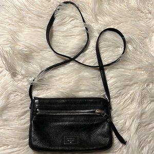 Small purse with long strap to wear crossbody style.